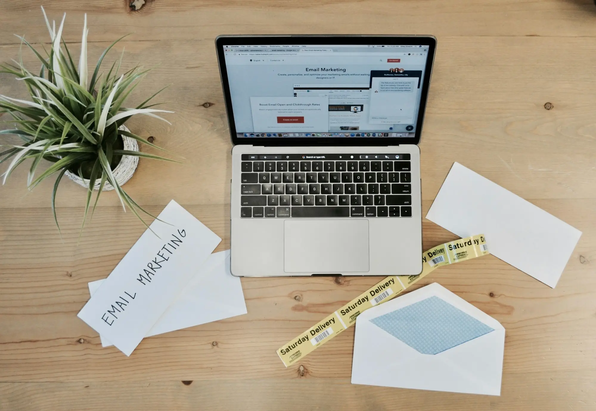 Customs paperwork and envelopes beside a laptop