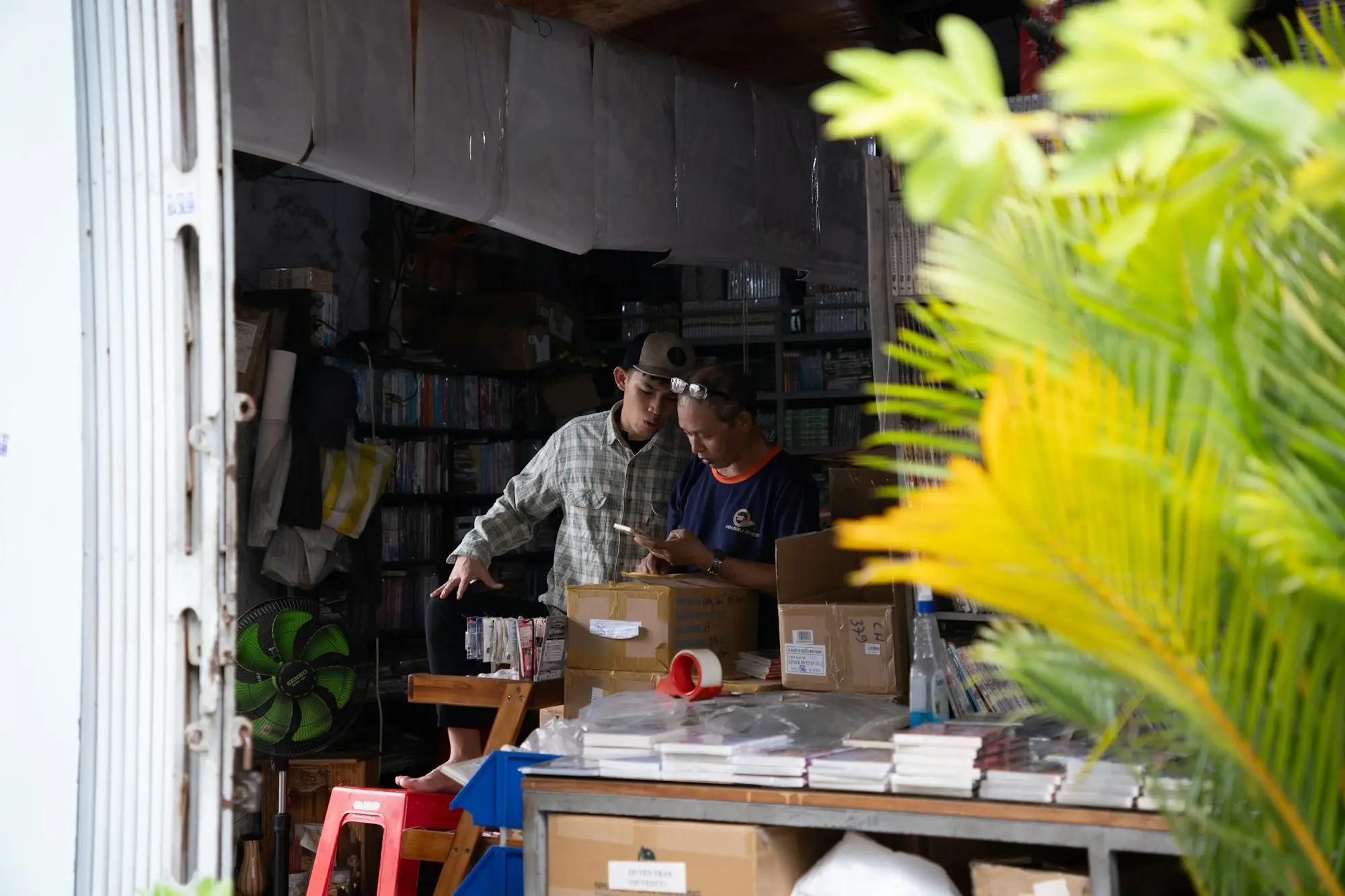 Exporter packing cartons for shipping in a small workshop